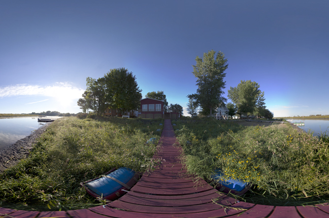 Panoramic photograph of cabins on stilts on Île Bibeau
