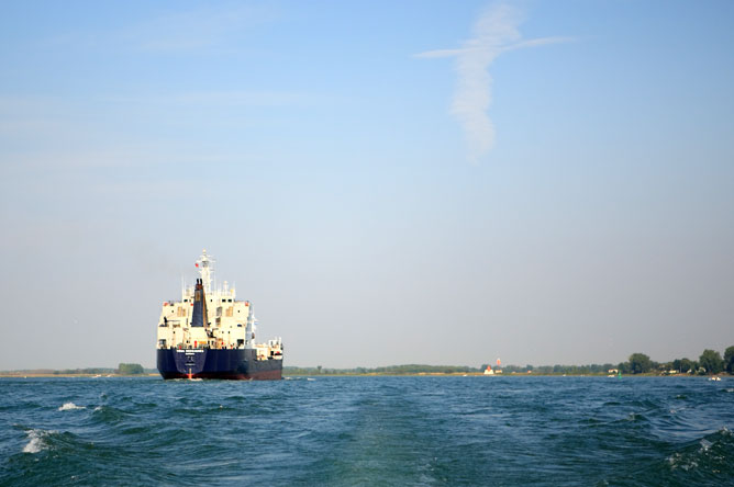 A ship sails along the St. Lawrence Seaway toward Lake Saint-Pierre.