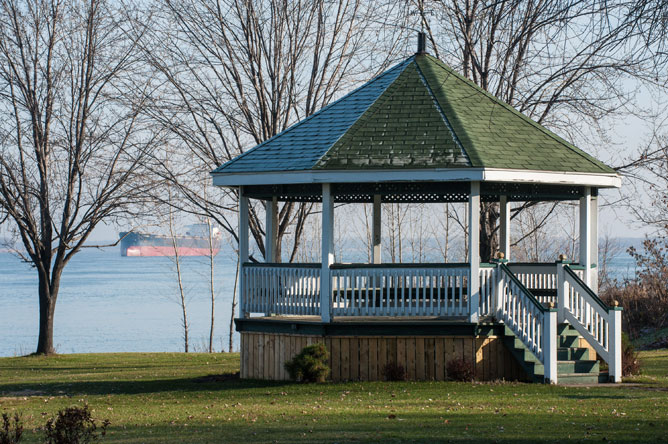 Gazebo in Pointe-aux-Pins Park and commercial vessel on the river