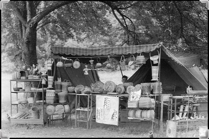 A man behind his basket stand in Massachusetts, circa 1930