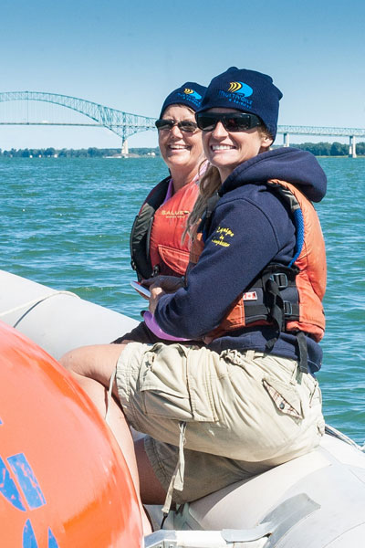 Two women in a rubber dinghy on Lake Saint-Pierre