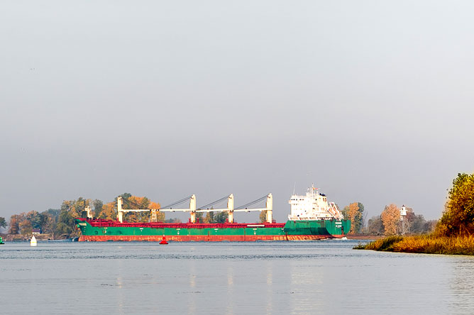 A commercial vessel sails along the St. Lawrence Seaway.