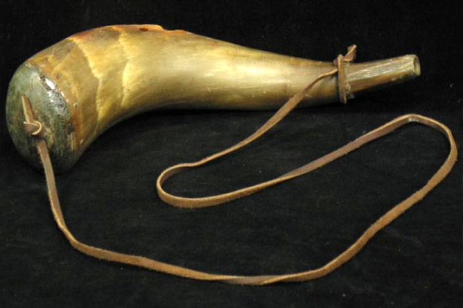 Bull's horn used to carry gunpowder.
